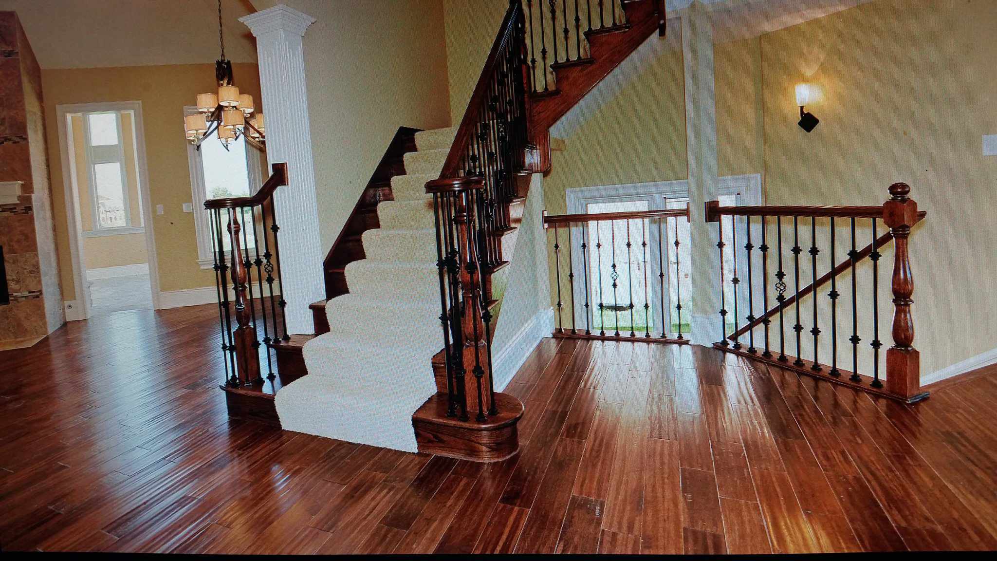 beautiful hardwood floor and staircase